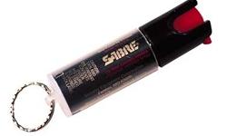 Sabre Key Ring Spray .54oz Red Pepper, CS Tear Gas & UV Dye. The KEY RING provides security in a simple compact canister with key chain attachment. The small, yet powerful 0.54 oz. KEY RING delivers a ballistic stream which reduces wind blow-back. This